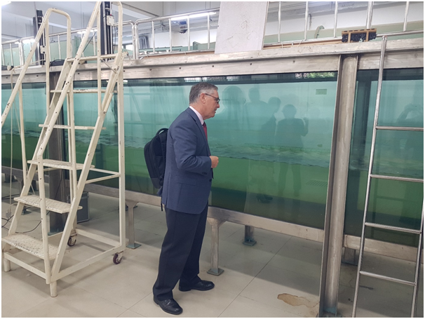 UNSW Associate Dean International, Professor David Lovell examining the wave tank in the College of Oceanography and Meteorology, Ocean University of China, Qingdao.